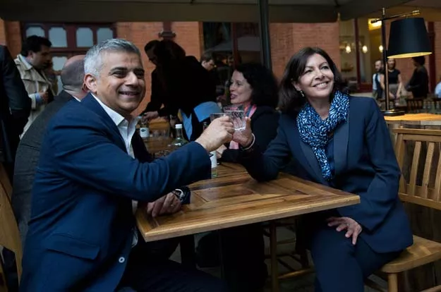 mayor of london sadiq khan l and mayor of paris anne hidalgo raise a glass for a toast as they sit down for a meeting at st pancras station in london on may 10 2016 photo afp mayor of london sadiq khan l and mayor of paris anne hidalgo raise a glass for a toast as they sit down for a meeting at st pancras station in london on may 10 2016 photo afp