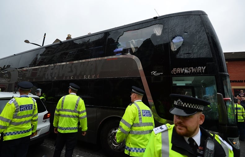 west ham fans throw cans of beer at the coach carrying manchester united players outside the boleyn ground before the english premier league football match between west ham united and manchester united in east london on may 10 2016 photo afp