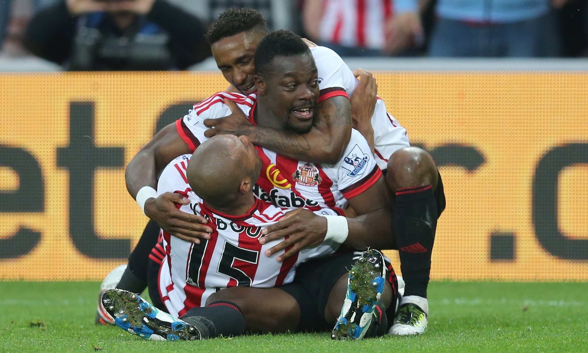 lamine kon celebrates with jermain defoe and younes kaboul after scoring the second goal for sunderland against everton at the stadium of light photo reuters