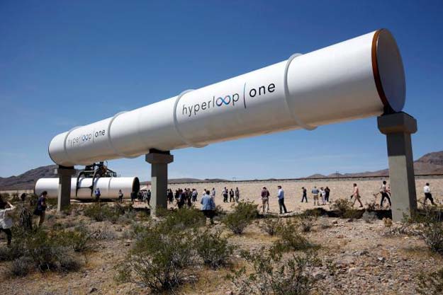 journalists and guests look over tubes following a propulsion open air test at hyperloop one in north las vegas nevada u s may 11 2016 photo reuters