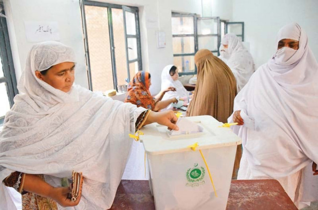 a woman casts her vote in the by polls in ariana village charsadda road photo muhammad iqbal express a woman casts her vote in the by polls in ariana village charsadda road photo muhammad iqbal express