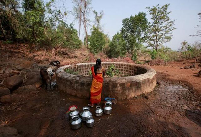 a resident fetches water from a well outside denganmal village maharashtra india april 21 2015 photo reuters