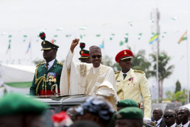 nigeria 039 s new president muhammadu buhari rides on the motorcade while inspecting the guard of honour at eagle square in abuja nigeria may 29 2015 photo reuters nigeria 039 s new president muhammadu buhari rides on the motorcade while inspecting the guard of honour at eagle square in abuja nigeria may 29 2015 photo reuters