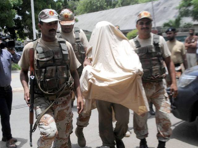 rangers bring a suspected killer of former kesc md to an anti terrorism court in karachi photo rashid ajmeri express