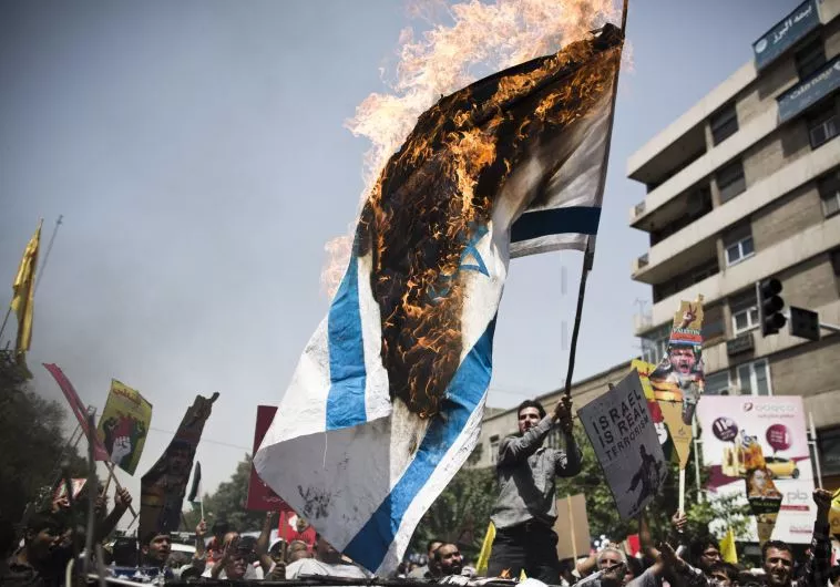 iranian protestors burn an israeli flag during a demonstration in tehran on july 25 2014 to mark the quds day photo afp iranian protestors burn an israeli flag during a demonstration in tehran on july 25 2014 to mark the quds day photo afp