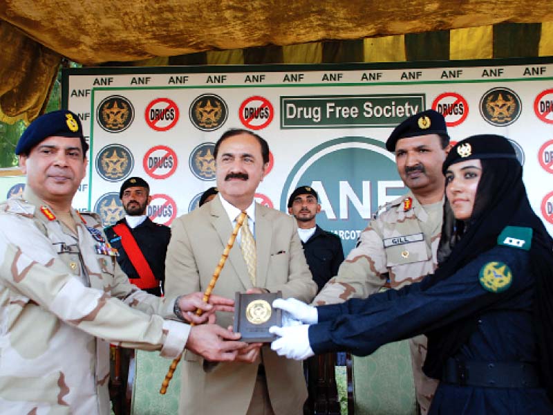 an officer receives her award at the anf recruits passing out parade photo express