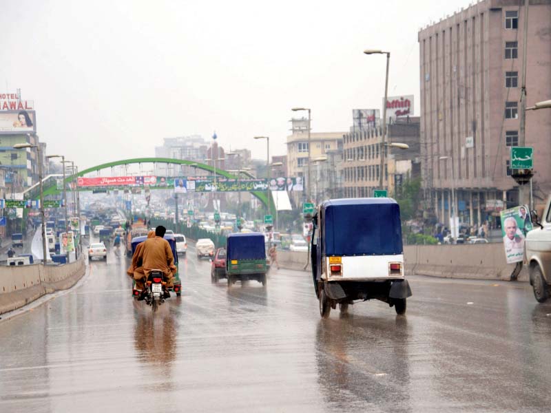 traffic remains thin on gt road as heavy rain lashes the city photo muhammad iqbal