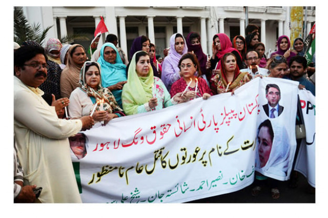 activiss of ppp human rights wing light candles in the memory of ambreen bibi who was klled by jirga members in abbotabad photo online activiss of ppp human rights wing light candles in the memory of ambreen bibi who was klled by jirga members in abbotabad photo online