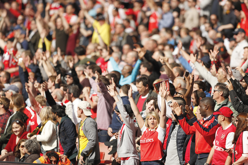 arsenal fans celebrate giroud s hat trick which ensured the gunners finish above rivals tottenham photo afp