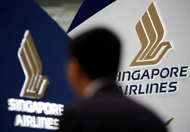 a man walks past a singapore airlines signage at changi airport in singapore may 11 2016 photo reuters a man walks past a singapore airlines signage at changi airport in singapore may 11 2016 photo reuters