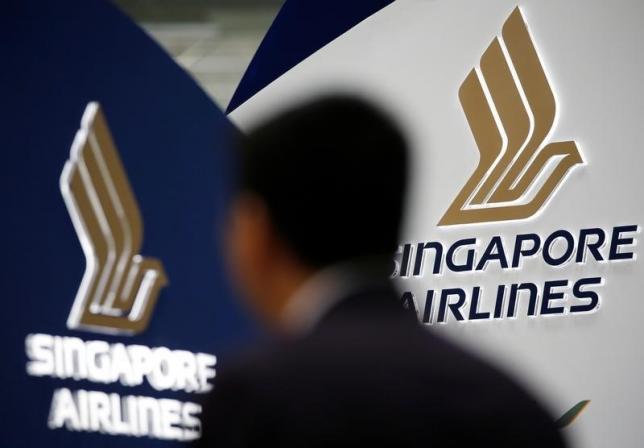 a man walks past a singapore airlines signage at changi airport in singapore may 11 2016 photo reuters