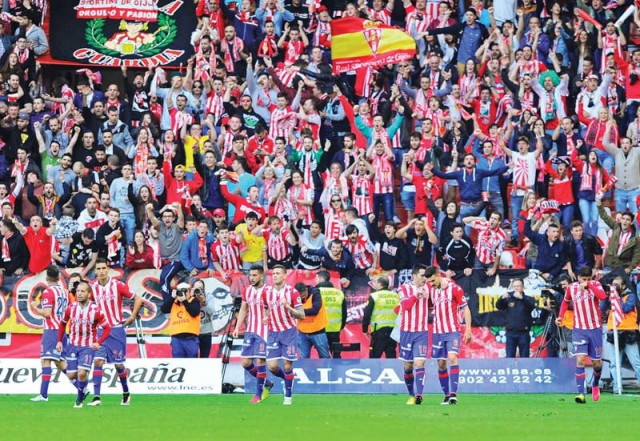 sporting s players celebrate a goal during their 2 0 win over villarreal that saw them extend their la liga stay for another year photo afp sporting s players celebrate a goal during their 2 0 win over villarreal that saw them extend their la liga stay for another year photo afp