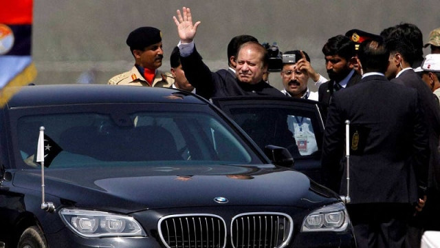 a file photo of prime minister nawaz sharif waving as he sits in his car photo afp