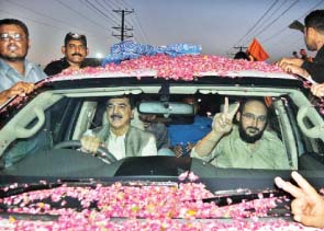 ali haider gillani is driven home by his father on tuesday from multan airport photo app