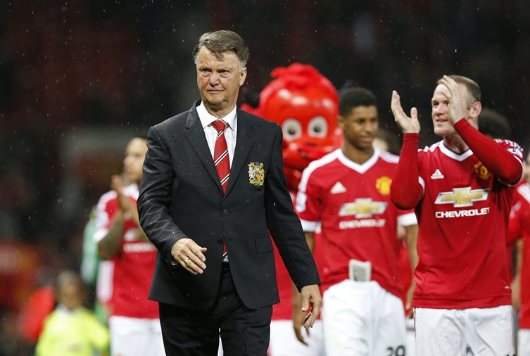 manchester united manager louis van gaal and wayne rooney during a lap of honour after their last league game against bournemouth on tuesday photo reuters