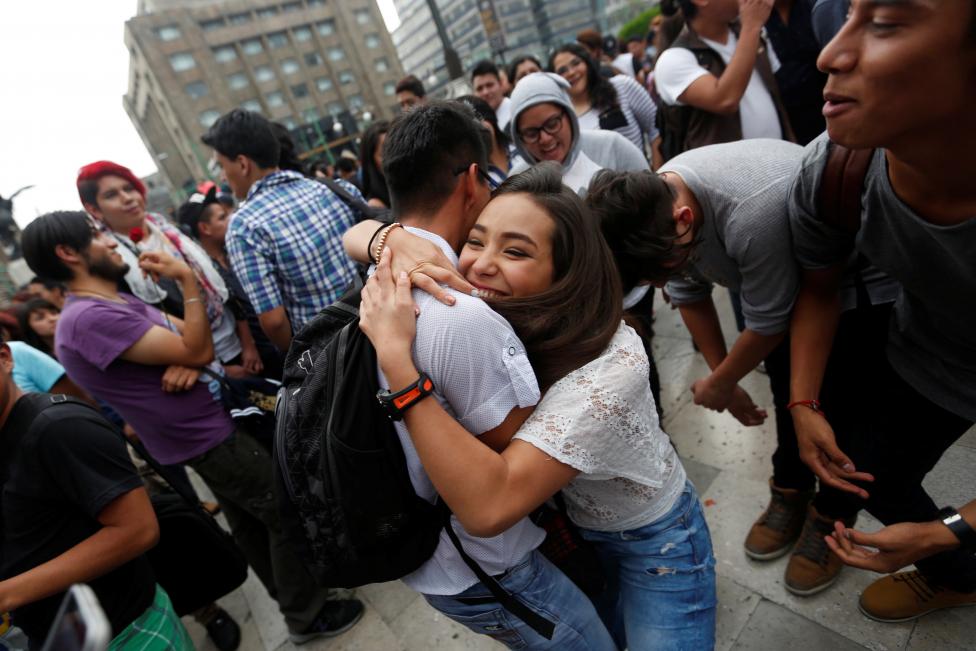 a couple embraces during a kissathon to celebrate international day against homophobia outside bellas artes museum in mexico city mexico may 17 2016 photo reuters