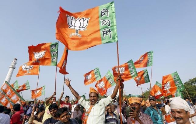 supporters of india ruling bharatiya janata party bjp wave their party flags in kolkata india april 17 2016 photo reuters