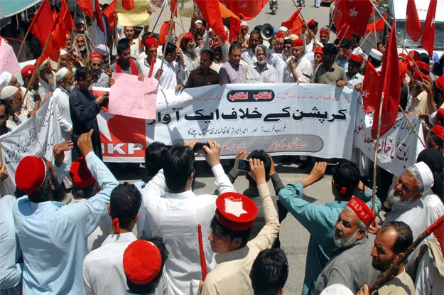 members of mazdoor kisan party chant slogans against corruption during protest demonstration photo ppi