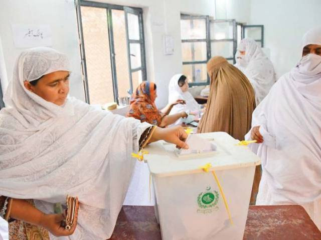 a woman casts her vote in the by polls in ariana village charsadda road photo muhammad iqbal express a woman casts her vote in the by polls in ariana village charsadda road photo muhammad iqbal express