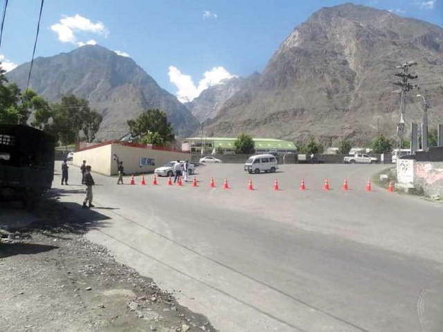 barriers placed on a road in gilgit photo express barriers placed on a road in gilgit photo express