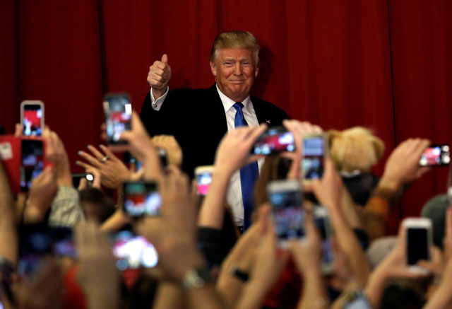 us republican presidential candidate donald trump greets supporters as he arrives to appear with new jersey governor chris christie at a fundraising event in lawrenceville new jersey us may 19 2016 photo reuters