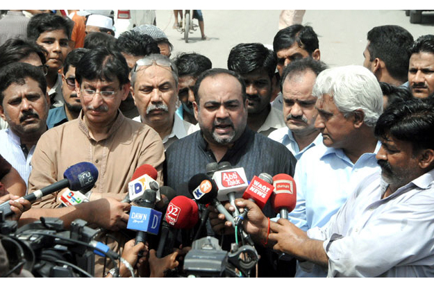 leader of the opposition in the sindh assembly mqm s khawaja izharul hassan speaking to the media after zaki s funeral on friday photo express