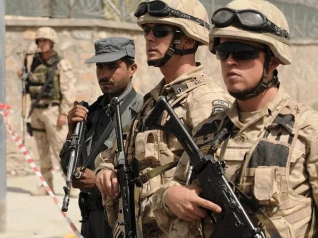 nato troops stand on guard in an fghan city photo afp nato troops stand on guard in an fghan city photo afp