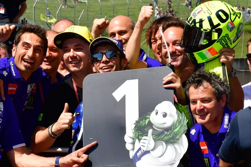 valentino rossi c celebrates pole position with his staff at end of qualification session for italian motogp grand prix at the racetrack in mugello on may 21 2016 photo afp valentino rossi c celebrates pole position with his staff at end of qualification session for italian motogp grand prix at the racetrack in mugello on may 21 2016 photo afp