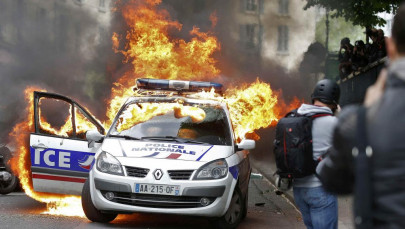 four charged with attempted murder after police car torched in france four charged with attempted murder after police car torched in france