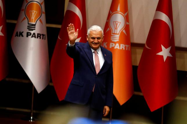 turkey 039 s likely next prime minister and incoming leader of the ruling ak party binali yildirim greets party members during a meeting in ankara turkey may 19 2016 photo reuters