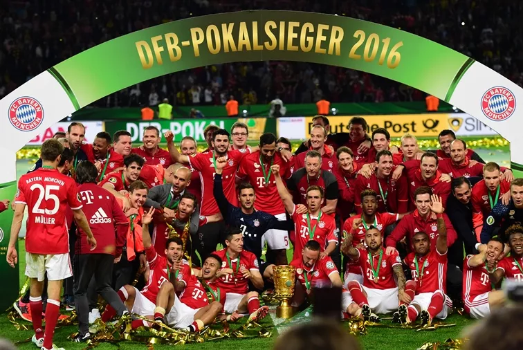 bayern munich 039 s players pose with the trophy after winning the german cup dfb pokal final football match bayern munich vs borussia dortmund at the olympic stadium in berlin on may 21 2016 photo afp bayern munich 039 s players pose with the trophy after winning the german cup dfb pokal final football match bayern munich vs borussia dortmund at the olympic stadium in berlin on may 21 2016 photo afp