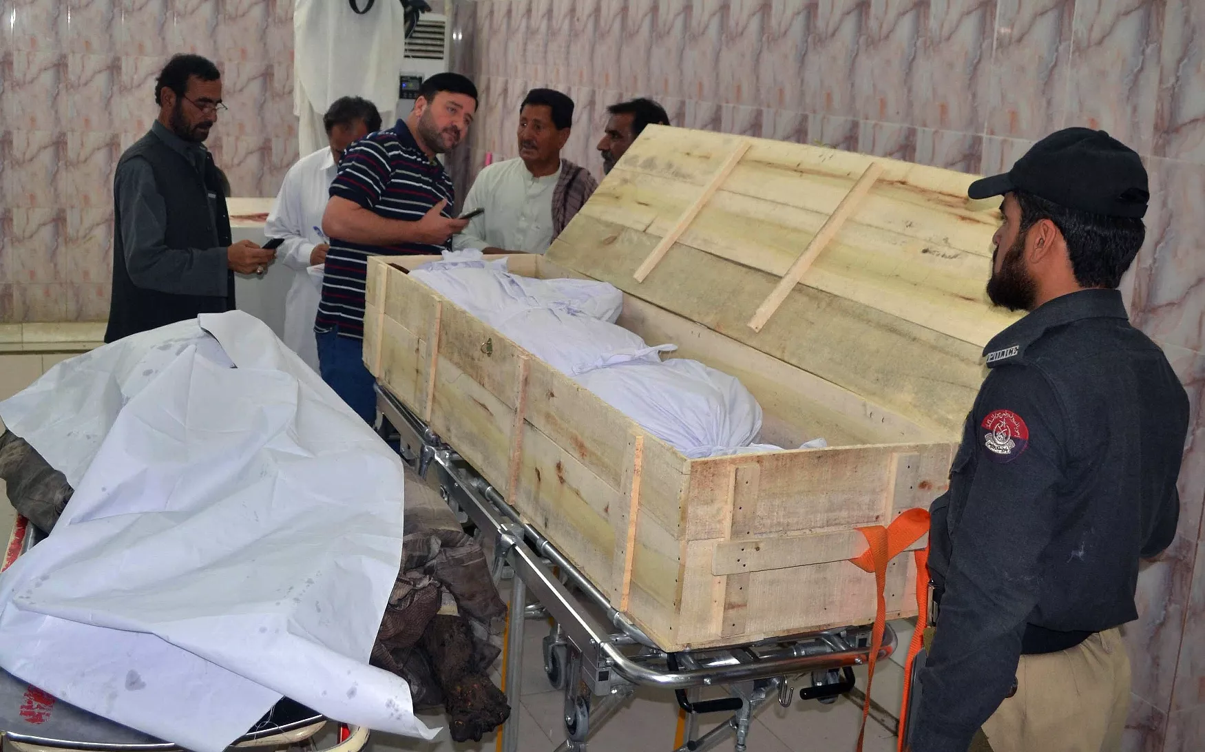 security officials and hospital staff stand next to unidentified dead bodies placed on stretchers at a morgue in a hospital in quetta on may 22 2016 which were brought following a drone strike in the remote town of ahmad wal in balochistan that targeted afghan taliban chief mullah akhtar mansour photo afp security officials and hospital staff stand next to unidentified dead bodies placed on stretchers at a morgue in a hospital in quetta on may 22 2016 which were brought following a drone strike in the remote town of ahmad wal in balochistan that targeted afghan taliban chief mullah akhtar mansour photo afp