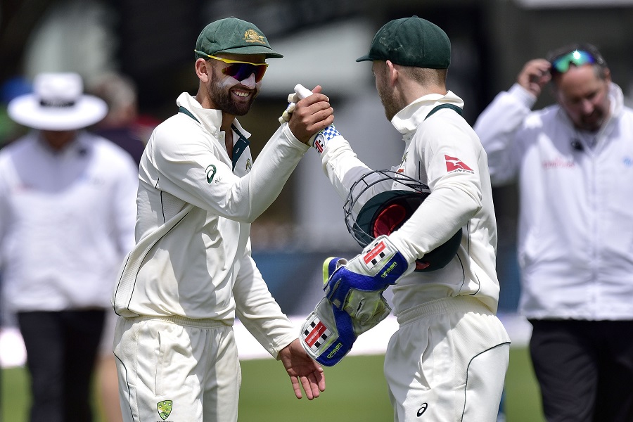 australia 039 s peter nevill centre r with teammate nathan lyon celebrate their win on day four of the first cricket test match between new zealand and australia at the basin reserve in wellington on february 15 2016 photo afp