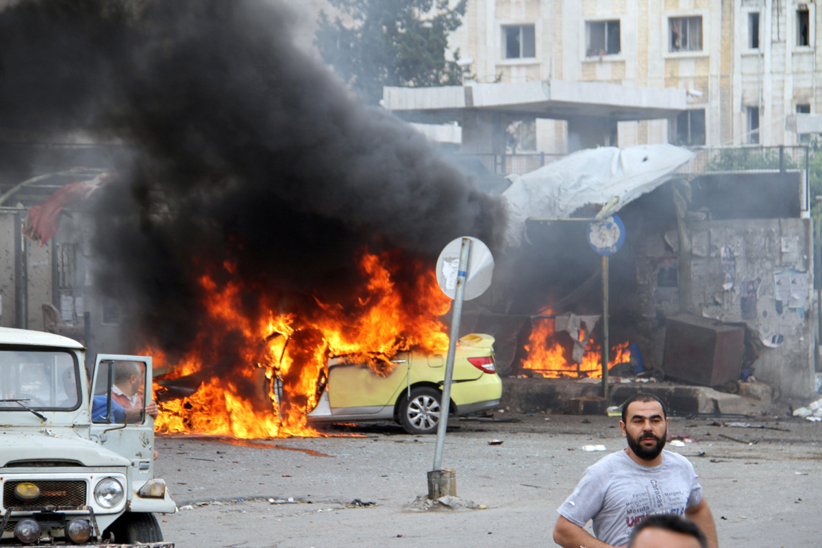 people inspect the damage after explosions hit the syrian city of tartous on may 23 2016 photo afp