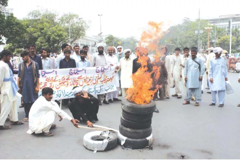 pki activists set fire to tyres on the mall photo abid nawaz express pki activists set fire to tyres on the mall photo abid nawaz express