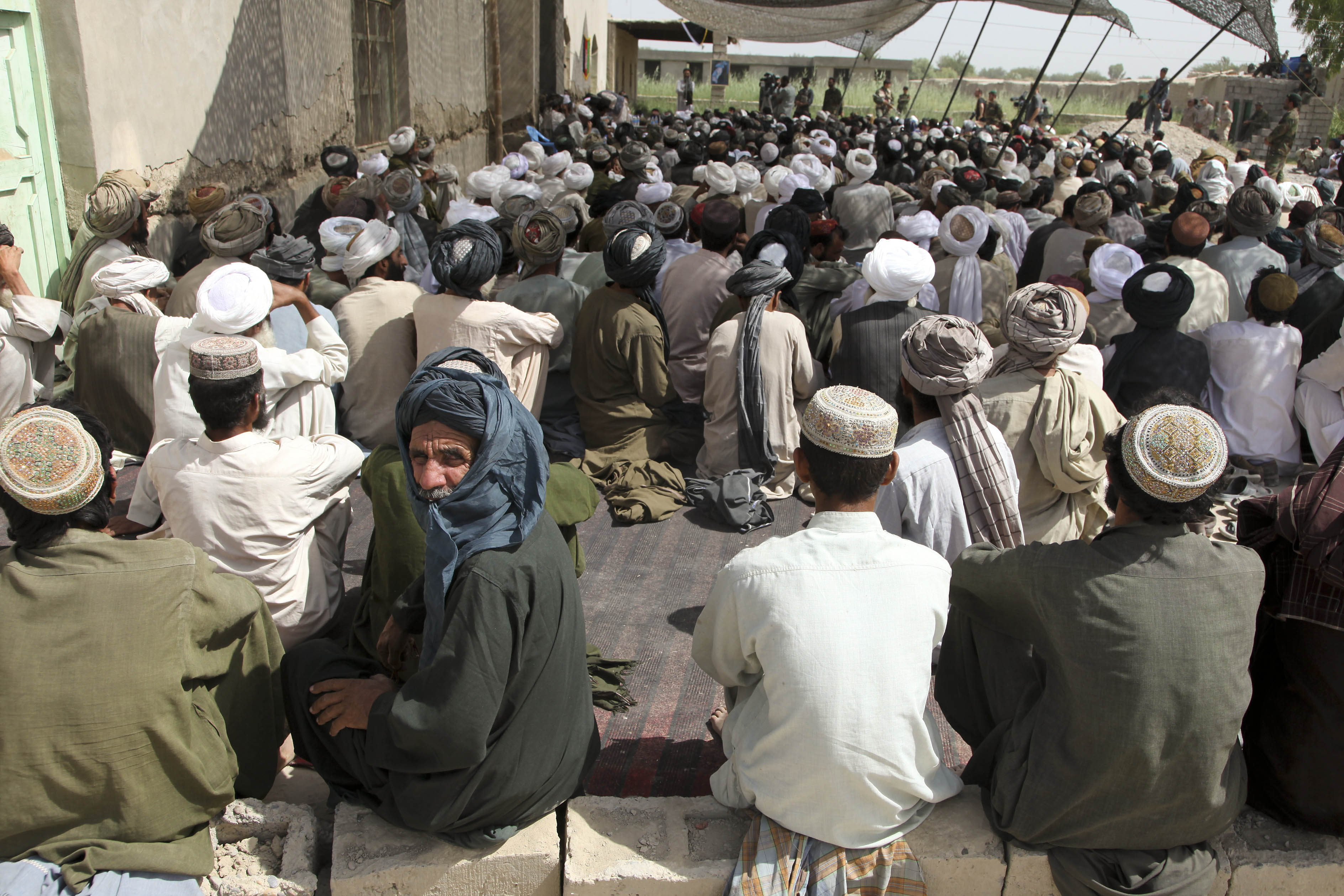 local afghan men attend a shura in the nawa district helmand province afghanistan on july 23 2009 afp photo
