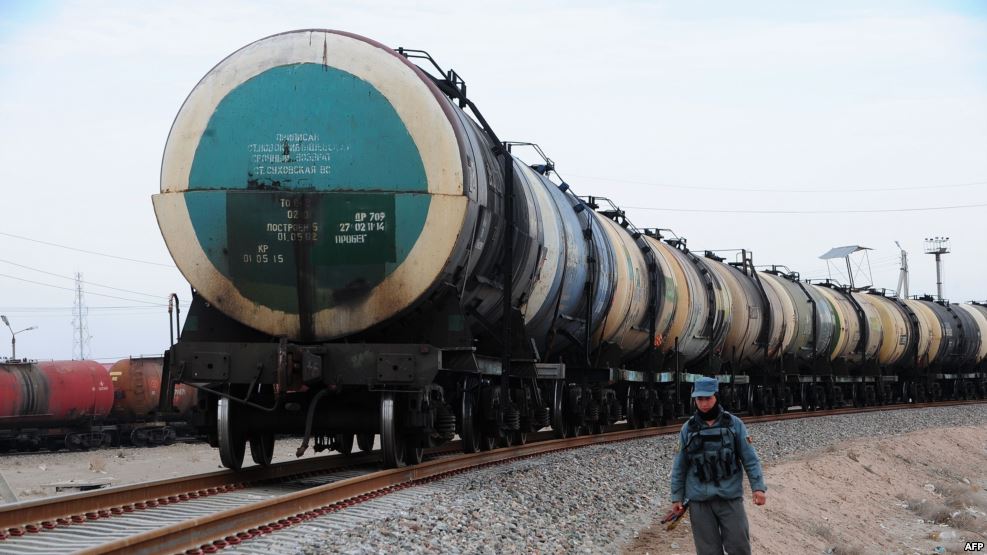 a policeman patrols alongside a new railway track in hairatan in northren afghanistan photo reuters