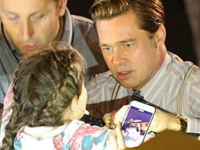 watch brad pitt saves little girl from being crushed by mob