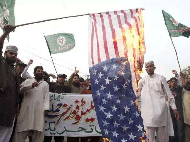 in this file photo protesters burn us flag photo inp in this file photo protesters burn us flag photo inp