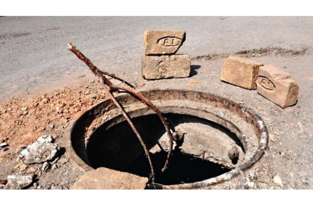 they had initially refused to descend the 10 foot manhole but the chief inspector had threatened to fire them photo express file they had initially refused to descend the 10 foot manhole but the chief inspector had threatened to fire them photo express file