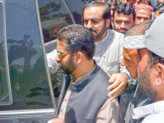 officials lead away balochistan chief minister s former finance adviser mir khalid langov following his arrest photo naseem james express officials lead away balochistan chief minister s former finance adviser mir khalid langov following his arrest photo naseem james express