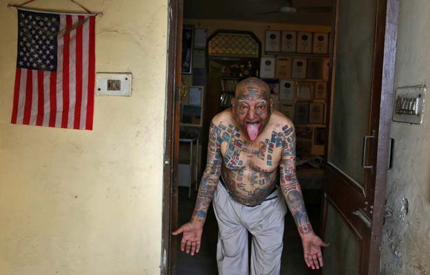 guinness rishi 74 multiple world record holder including most flags tattooed on his body poses for a photograph outside his apartment in new delhi india may 20 2016 photo reuters