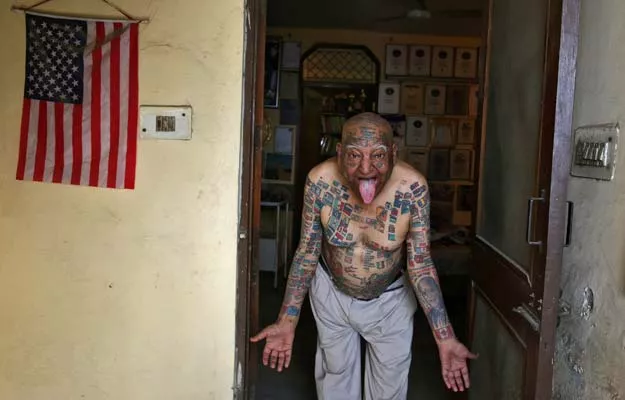 guinness rishi 74 multiple world record holder including most flags tattooed on his body poses for a photograph outside his apartment in new delhi india may 20 2016 photo reuters guinness rishi 74 multiple world record holder including most flags tattooed on his body poses for a photograph outside his apartment in new delhi india may 20 2016 photo reuters