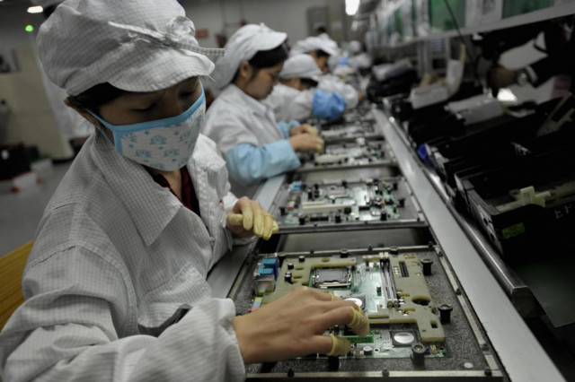 workers assemble components at the foxconn factory in shenzen china photo afp workers assemble components at the foxconn factory in shenzen china photo afp