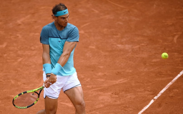 spain 039 s rafael nadal returns the ball to argentina 039 s facundo bagnis during their men 039 s second round match at the roland garros 2016 french tennis open in paris on may 26 2016 photo afp spain 039 s rafael nadal returns the ball to argentina 039 s facundo bagnis during their men 039 s second round match at the roland garros 2016 french tennis open in paris on may 26 2016 photo afp