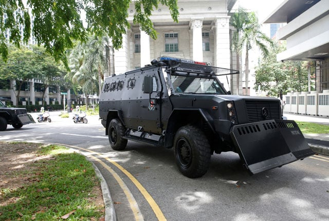 a convoy of armoured police vehicles carrying bangladeshi workers who were detained for planning attacks in their home country arrives at the state court in singapore may 27 2016 photo reuters