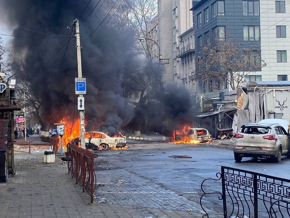 sensitive material this image may offend or disturb cars burn on a street after a russian military strike amid russia s attack of ukraine in kherson ukraine december 24 2022 ukrainian presidential press service handout via reuters