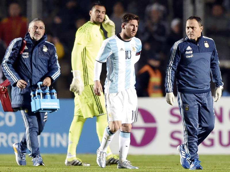 an alarming incident in the second half forced messi to leave the field clutching his lower back in pain photo afp
