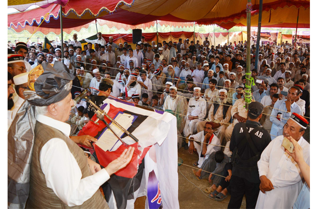 qaumi watan party chairperson aftab ahmad khan sherpao addressing a public gathering held in tangi charsadda on saturday photo express