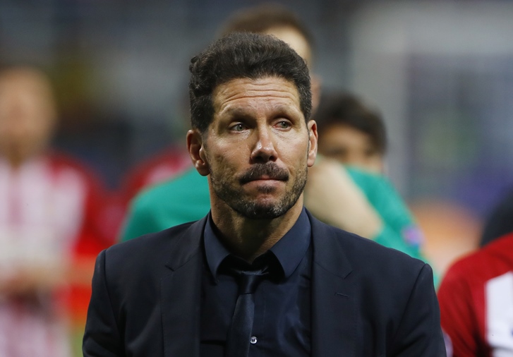 atletico madrid coach diego simeone looks dejected after the penalty shootout against real madrid where his team lost 5 3 on may 28 at san siro milan photo reuters
